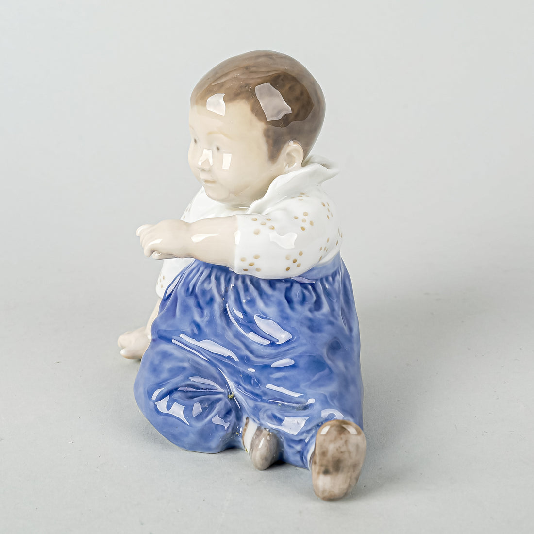 ROYAL COPENHAGEN Figurine Child With Blue Pants 1517