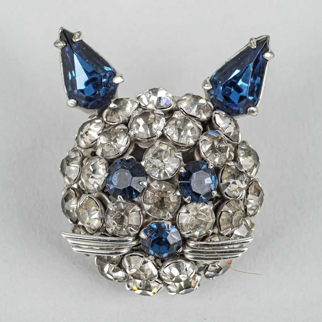 SHERMAN Silver Tone Clear Blue Rhinestone Cat Face Brooch