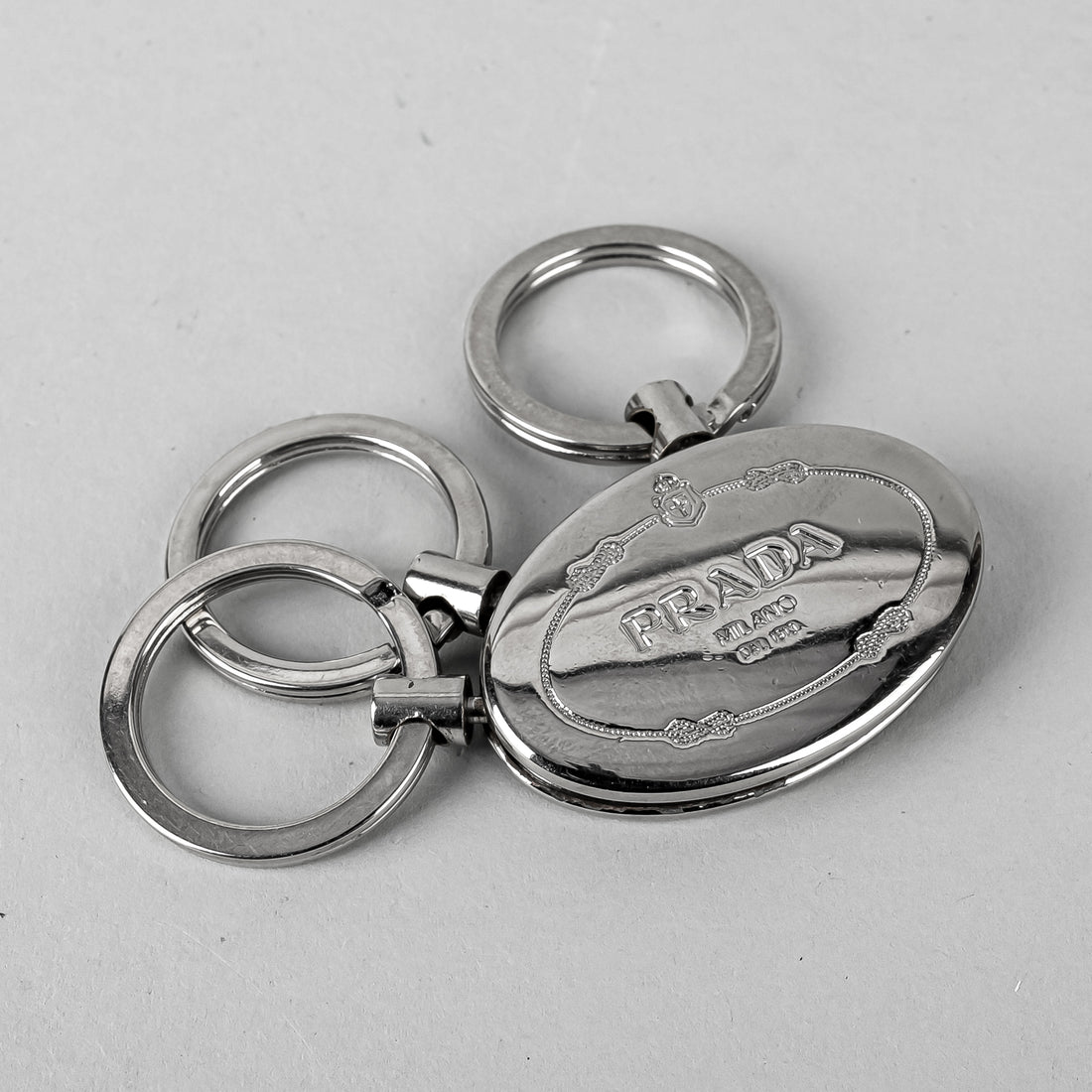 PRADA Silver Tone Oval 3 Ring Key Chain