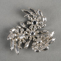 SHERMAN Silver Tone Blue Rhinestones Pinwheel Brooch