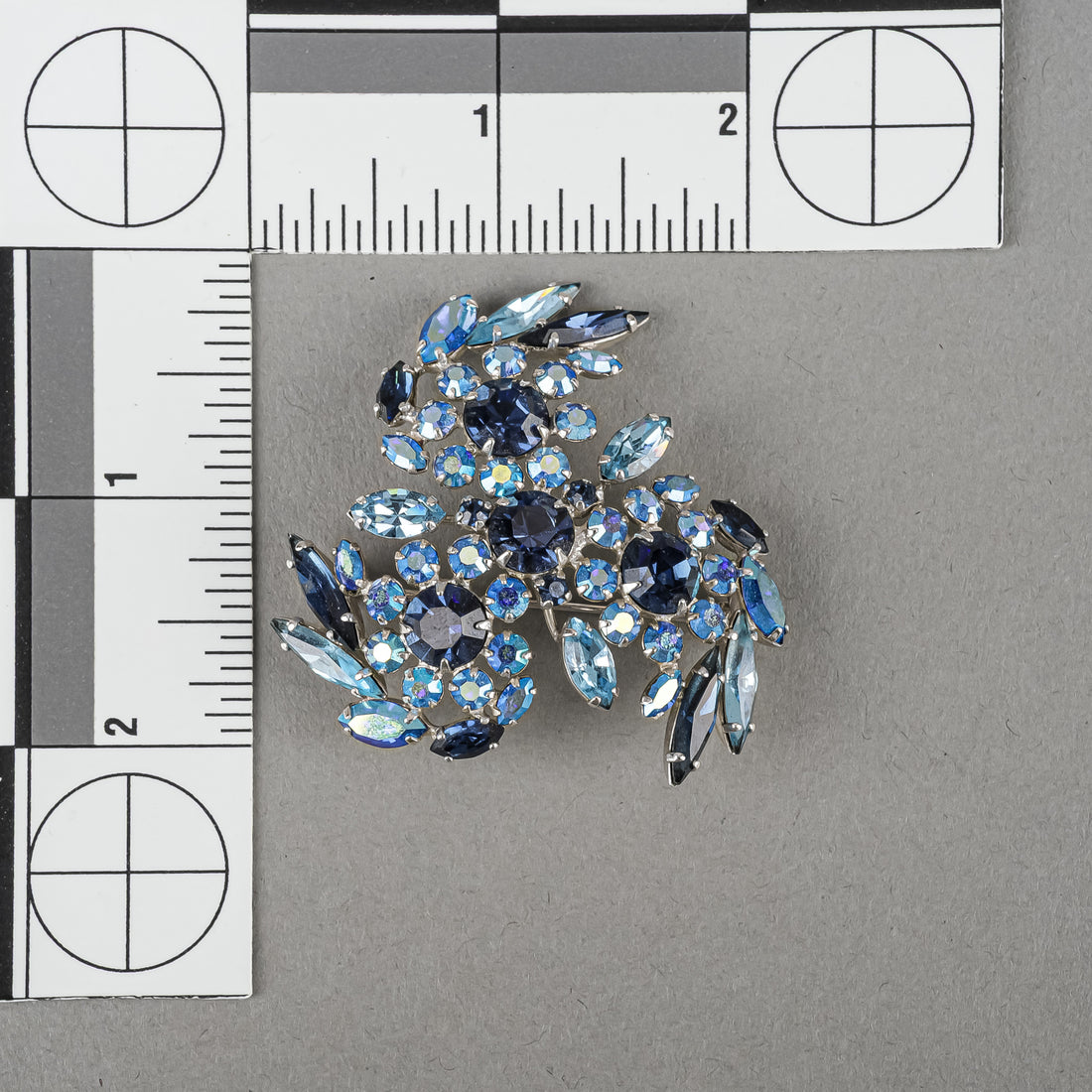 SHERMAN Silver Tone Blue Rhinestones Pinwheel Brooch