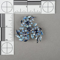 SHERMAN Silver Tone Blue Rhinestones Pinwheel Brooch