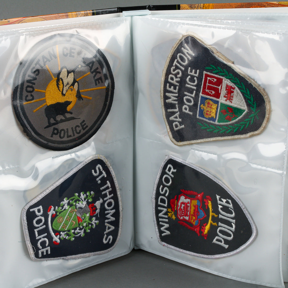 Assorted Police Patches in Binder - Set of 54