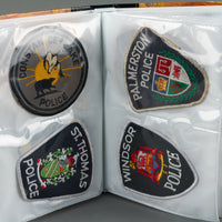 Assorted Police Patches in Binder - Set of 54