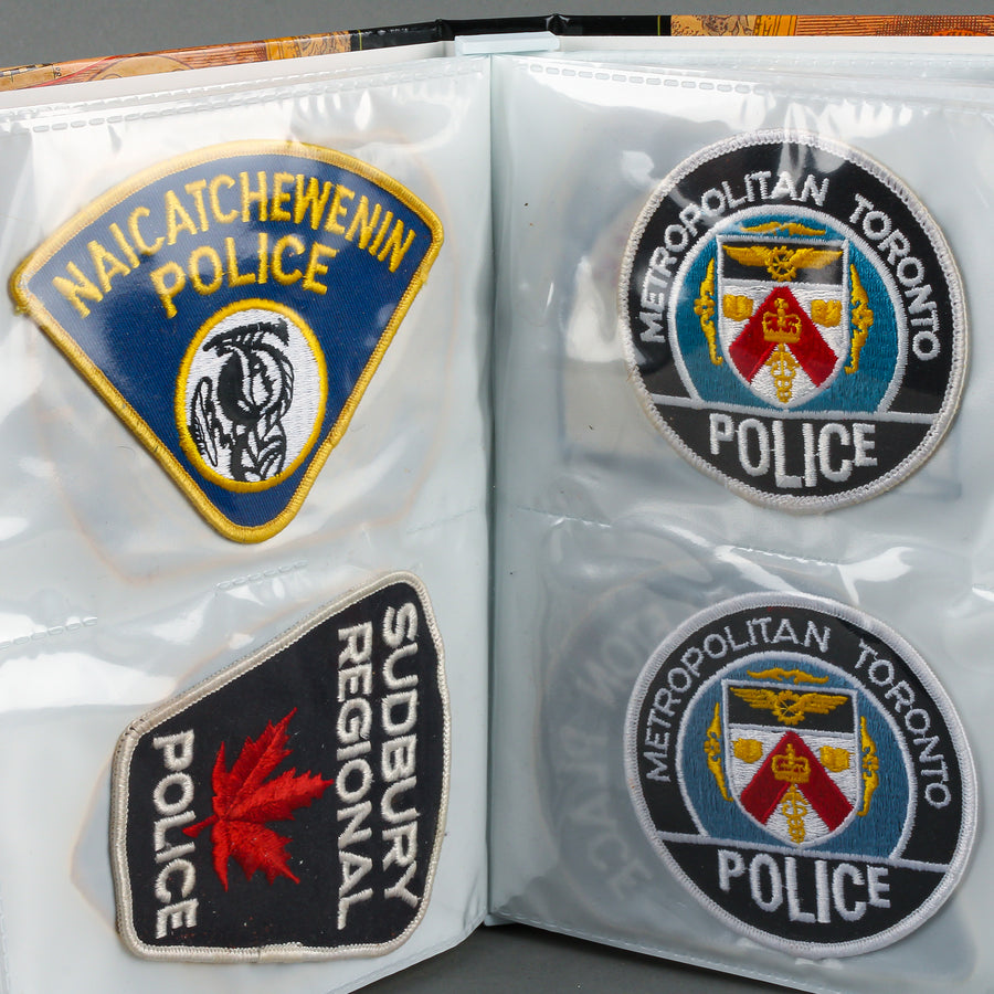 Assorted Police Patches in Binder - Set of 54