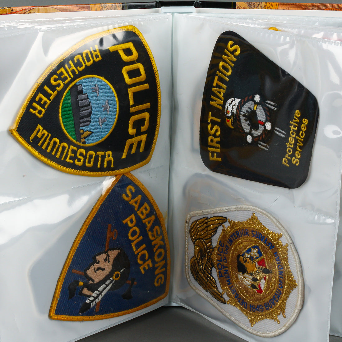 Assorted Police Patches in Binder - Set of 54
