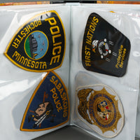Assorted Police Patches in Binder - Set of 54