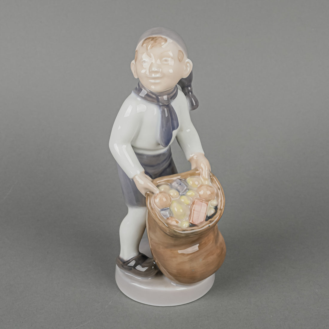 ROYAL COPENHAGEN Figurine Boy With Sack Of Gifts 4534